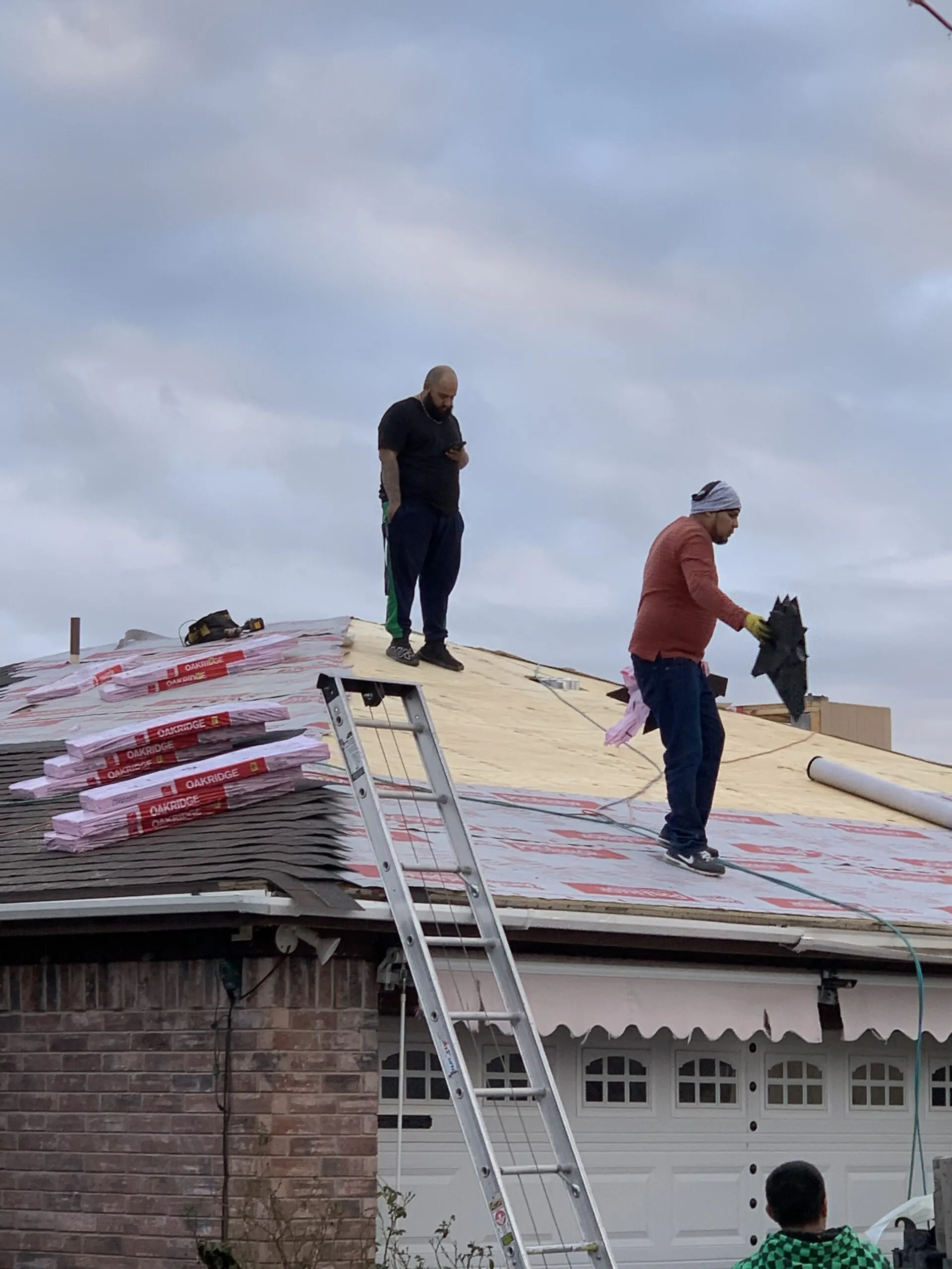 Phoenix Restoration crew on a roof in Fort Worth, TX